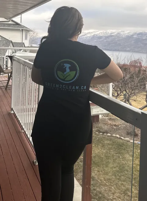 A team member wearing the Green2Clean uniform at a home cleaning service.